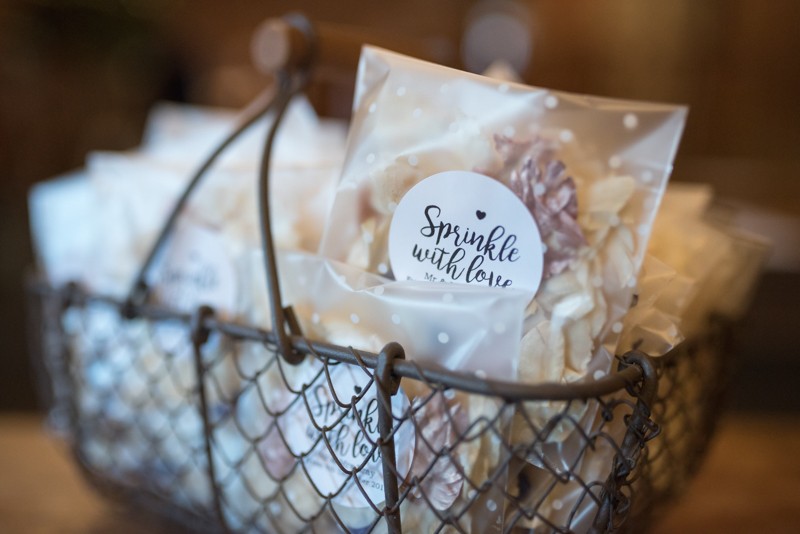 simple beautiful. nicely captured basket full of confetti as a wedding detail